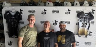 Three men pose together in front of a ChristianAthletes backdrop with hockey-style jerseys hanging behind them.