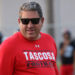 Tascosa - Ken Plunk 2 | Press Pass Sports Man wearing a red Tascosa Football shirt and dark sunglasses, outdoors during daytime.