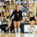 west-plains-vs-amarillo-high-2026-jpegJoe-pps-9 | Press Pass Sports Volleyball players on the court celebrate; a player in black with number 2 smiles as teammates in beige jerseys (numbers 20 and 9) stand nearby, cheering crowd in the stands behind.