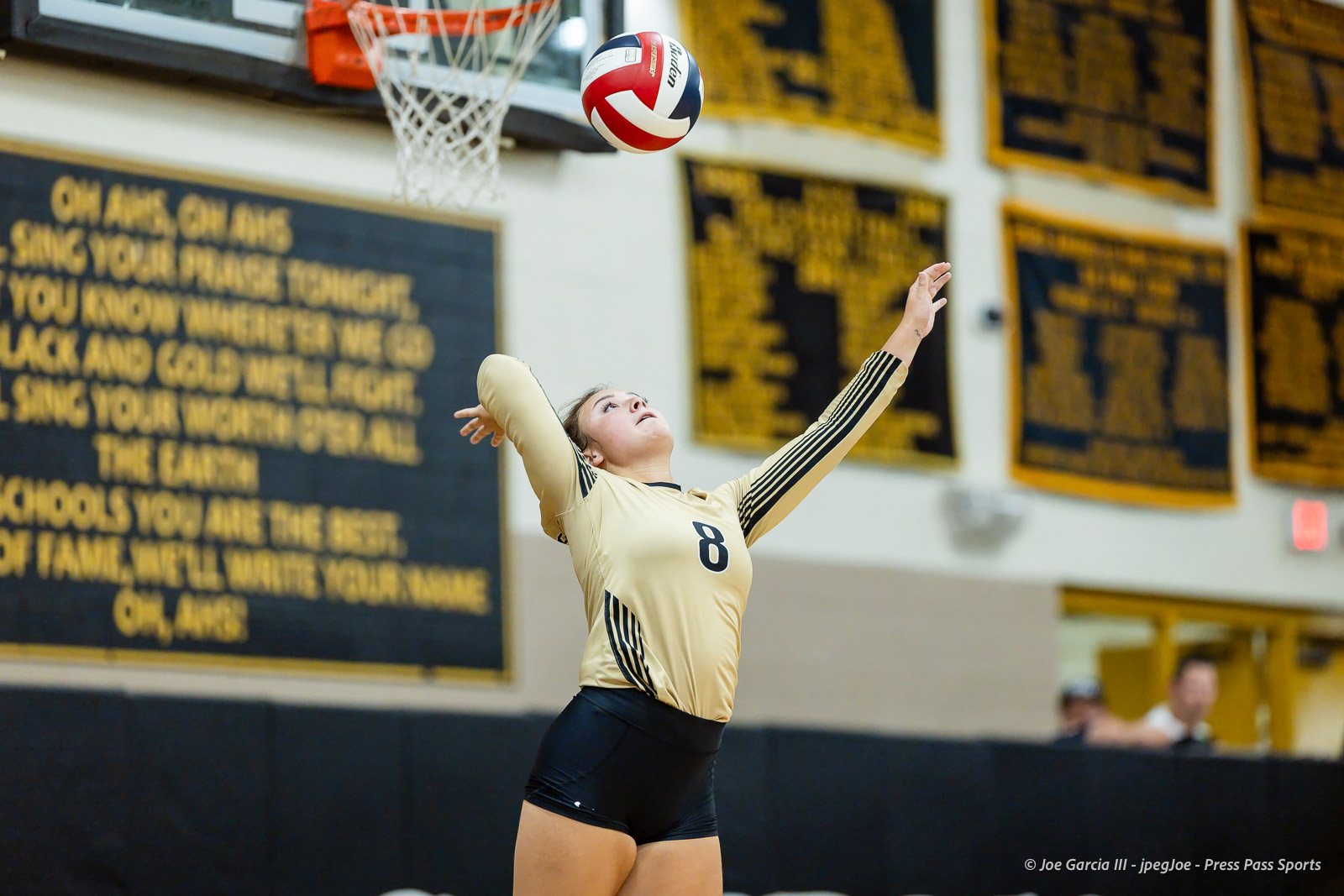 west-plains-vs-amarillo-high-2026-jpegJoe-pps-5 | Press Pass Sports Volleyball player in a beige jersey numbered 8, arms raised to set the ball indoors during a game.