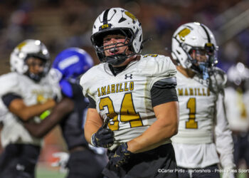 20260828-AmarilloHigh-PaloDuro-FB-032 | Press Pass Sports Football player in a white and gold uniform with number 44 running on the field during a game, teammates in white jerseys behind him