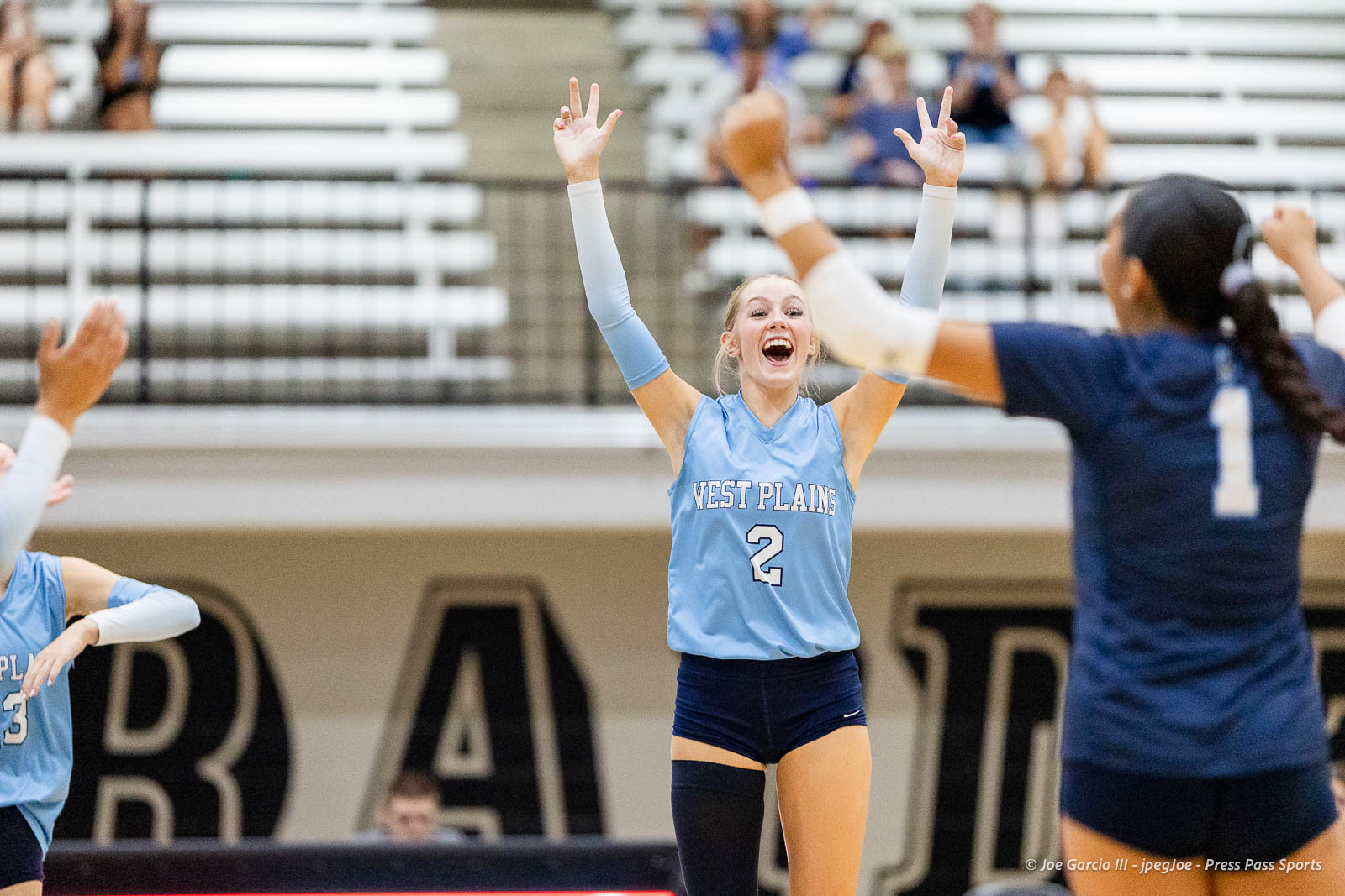 randall-showcase-2026-jpegJoe-pps-23 | Press Pass Sports Celebrating volleyball player in a light blue West Plains jersey #2 raises arms in celebration on the court.