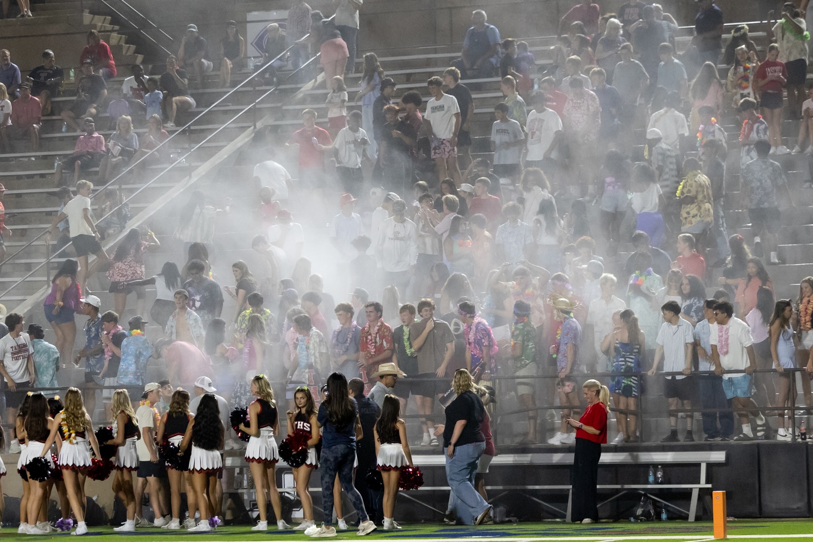 THS-CHS-FB-43 | Press Pass Sports Crowd on stadium bleachers at a pep rally with smoke and cheerleaders on the field in the foreground.