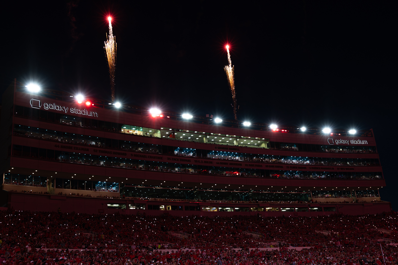 Tech-Abilene-FB-28 | Press Pass Sports Night view of a crowded stadium with fireworks bursting above and Galaxy Stadium signage on the façade.”