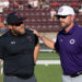 THS-CHS-FB-1 | Press Pass Sports Two coaches on a football field converse, one in black with a Texas Tech cap and sunglasses, the other in purple with a white Cincinnati cap.