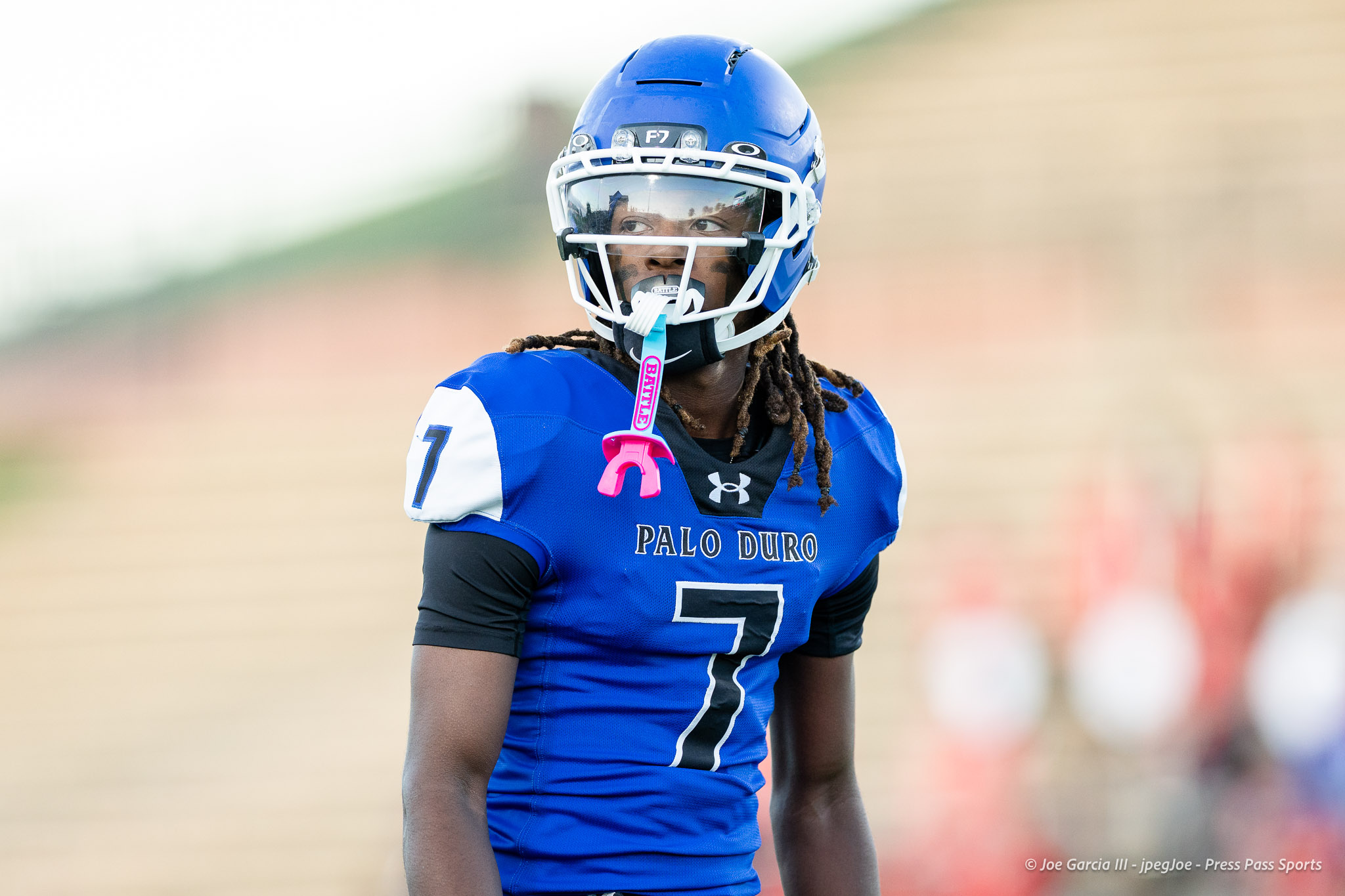 abilene-cooper-vs-palo-duro-jpegJoe-pps-3 | Press Pass Sports Football player in blue jersey with number 7 wearing a white helmet and reflective visor, on a field. The jersey reads Palo Duro.
