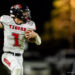 groom-vs-follett-football-jpegJoe-pps-23 | Press Pass Sports Football player in white 'Tigers' jersey runs with ball during night game, aimed forward with helmet and red number 1 visible on chest.