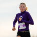 district-4a-canyon-xc-jpegJoe-pps-6 | Press Pass Sports Female runner in a purple long-sleeve top with bib 867, mid-race outdoors.